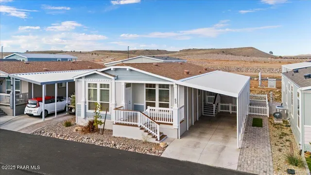 an aerial view of a house with a patio