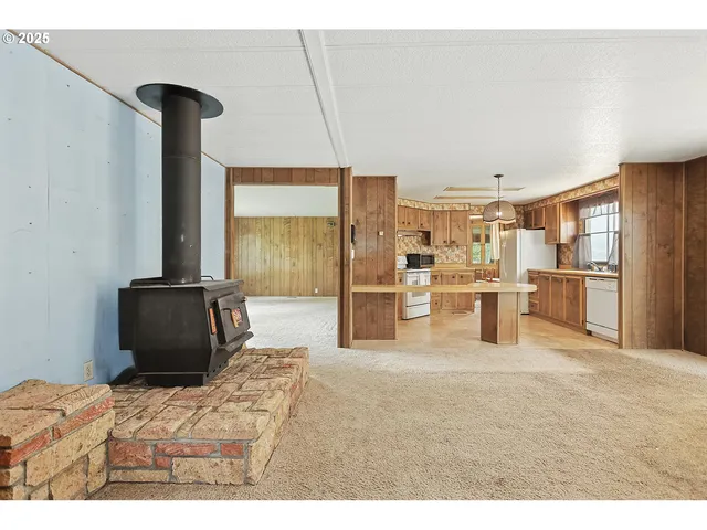 a kitchen with refrigerator and window