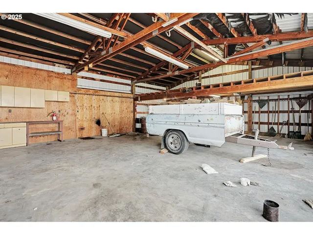 a large white kitchen with stainless steel appliances