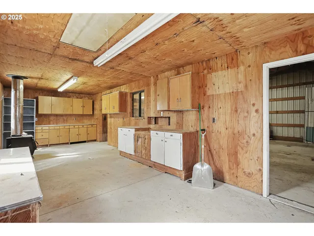 a view of living room with furniture and large window