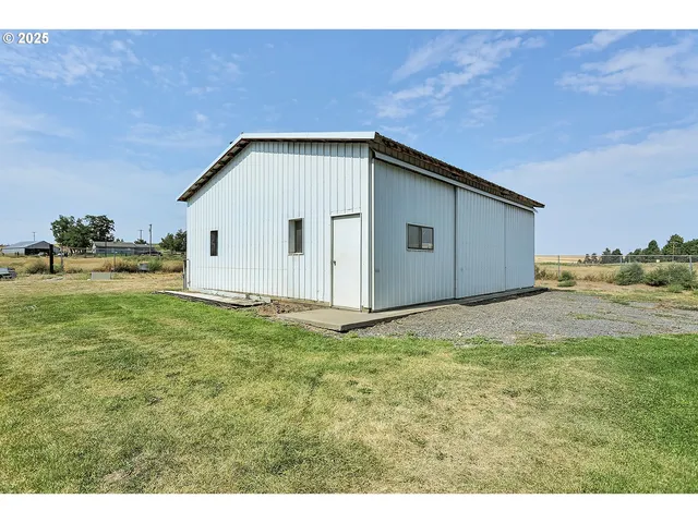 an aerial view of residential building and ocean view