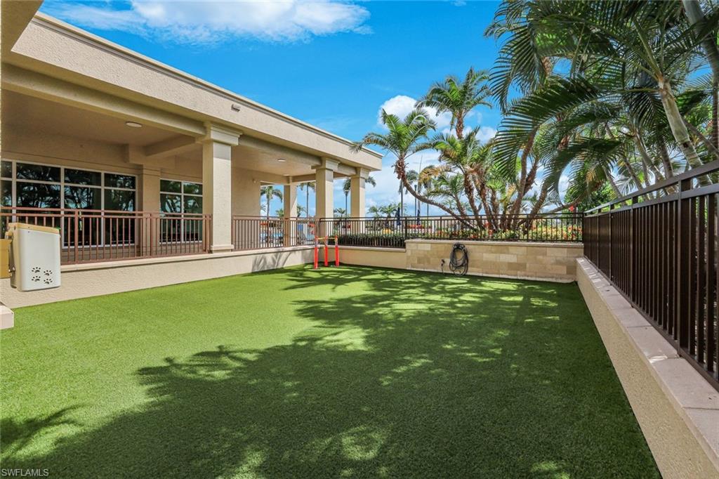 9123 Strada Place, Unit 7201 Naples, FL 34108 - Photo 23 of 50 a front view of a house with a garden