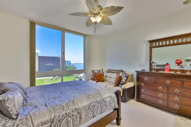 a bed room with a bed and a chandelier