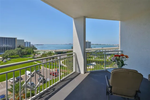 a view of balcony with furniture