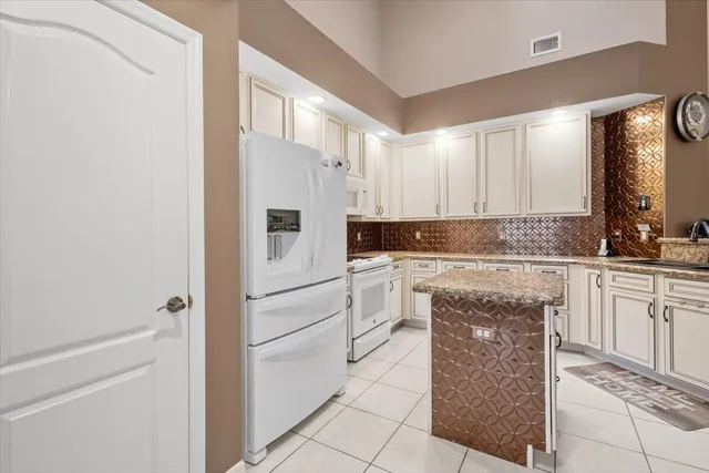 a kitchen with stainless steel appliances granite countertop a sink and cabinets