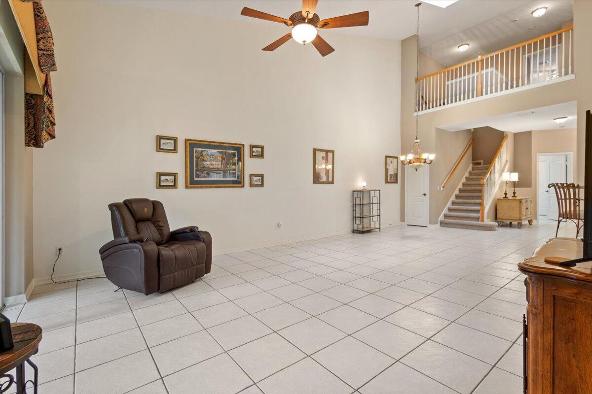 1634 Southwest Harbour Isles Circle, Unit 89 Port St. Lucie, FL 34986 - Photo 26 of 71 a living room with furniture and a rug