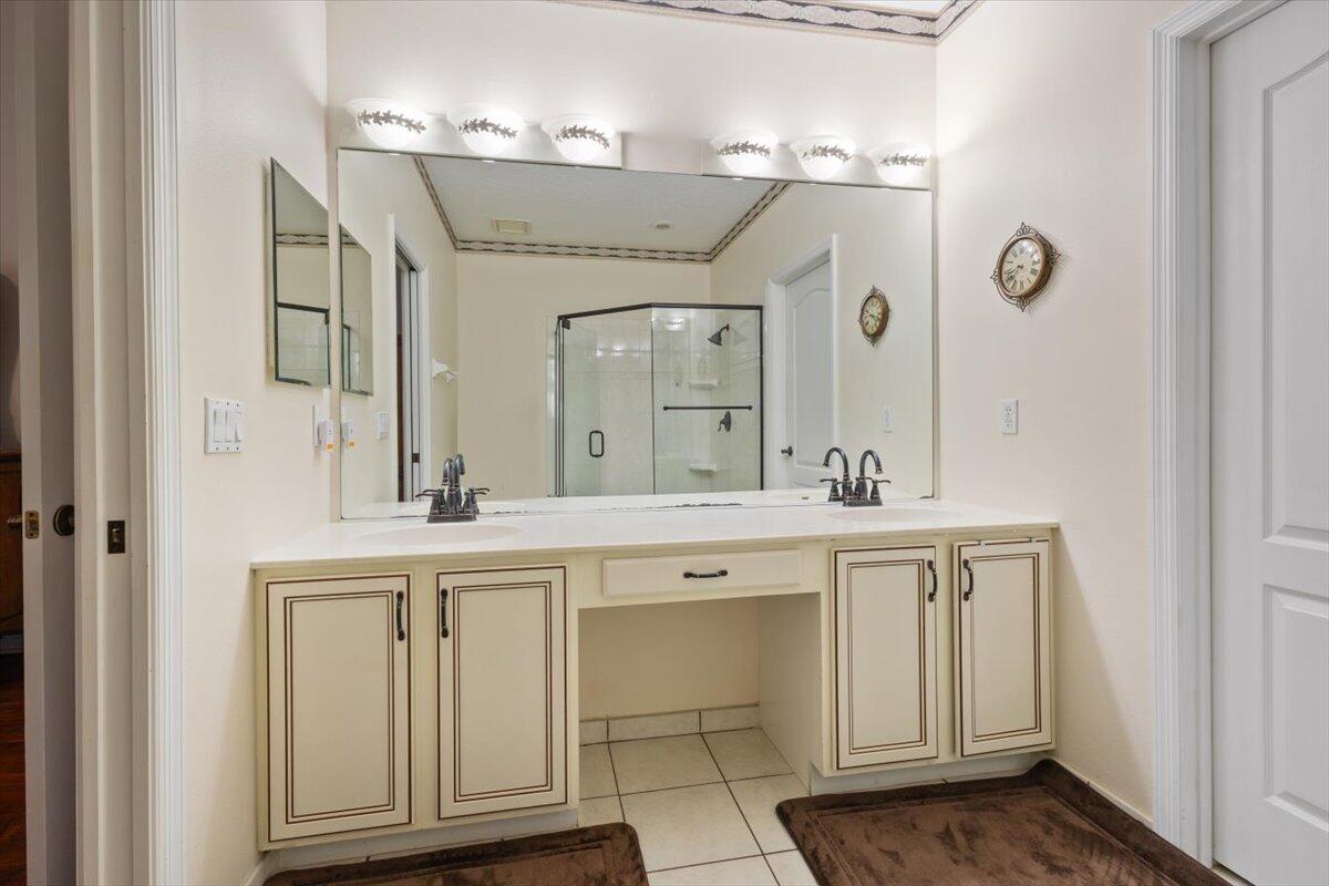 1634 Southwest Harbour Isles Circle, Unit 89 Port St. Lucie, FL 34986 - Photo 33 of 71 a spacious bathroom with a sink and a mirror
