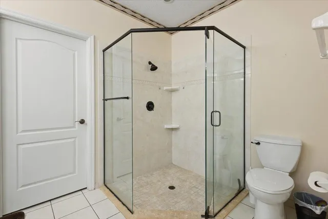 an empty room with a ceiling fan and a window