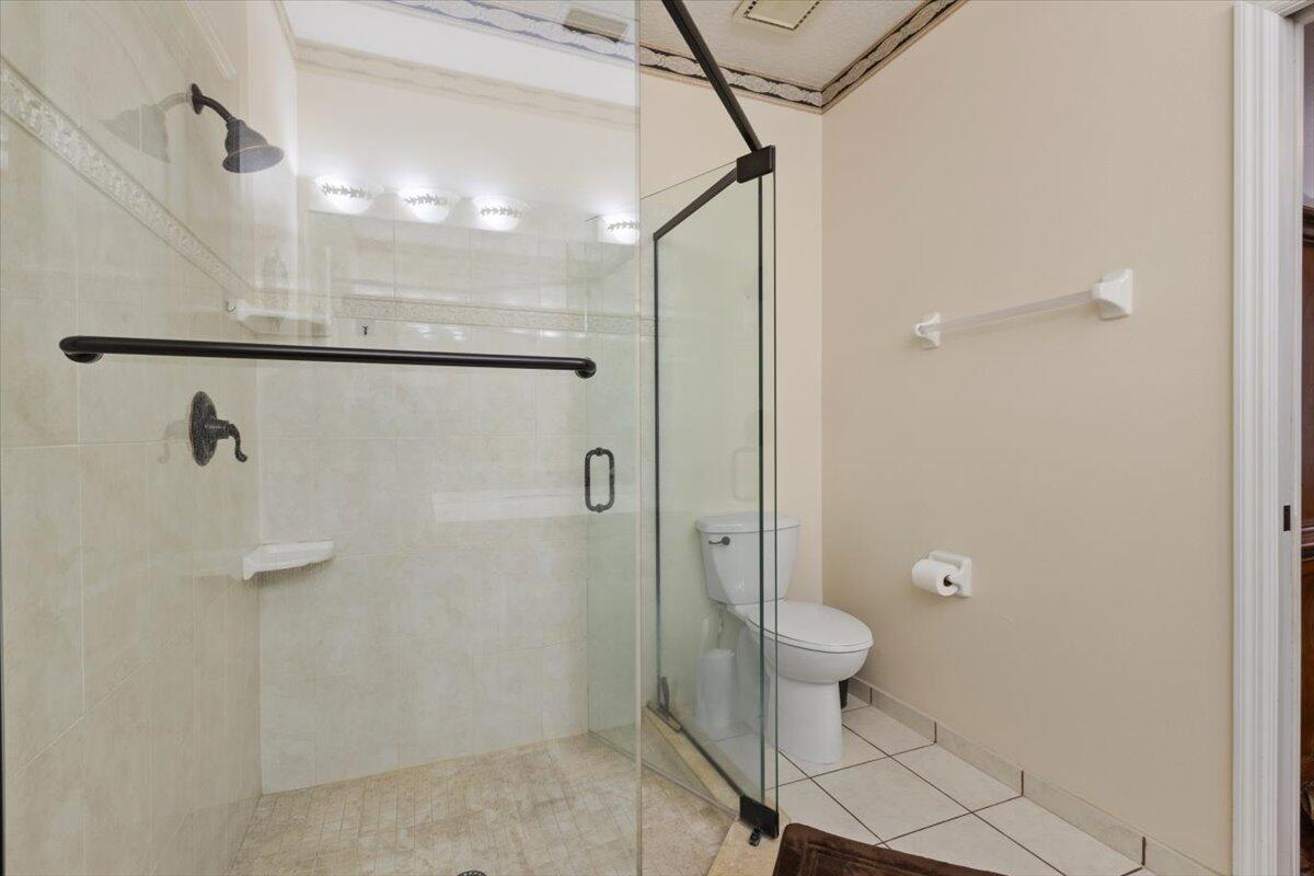 1634 Southwest Harbour Isles Circle, Unit 89 Port St. Lucie, FL 34986 - Photo 35 of 71 a bathroom with a shower and a toilet