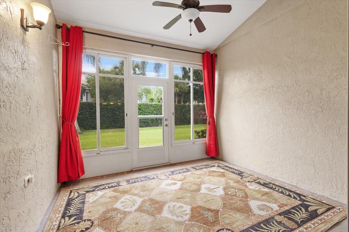 1634 Southwest Harbour Isles Circle, Unit 89 Port St. Lucie, FL 34986 - Photo 37 of 71 a view of a room with window and carpet