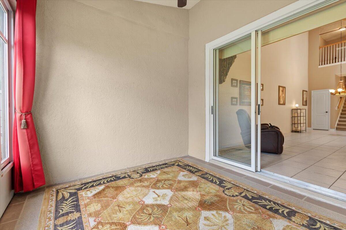 1634 Southwest Harbour Isles Circle, Unit 89 Port St. Lucie, FL 34986 - Photo 38 of 71 a view of a livingroom with wooden floor and a bathroom