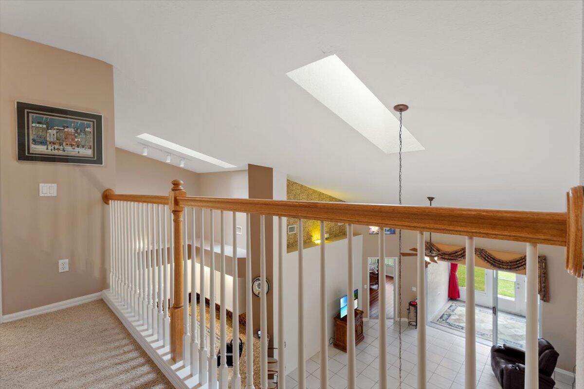 1634 Southwest Harbour Isles Circle, Unit 89 Port St. Lucie, FL 34986 - Photo 41 of 71 a view of a hallway with wooden floor and entryway