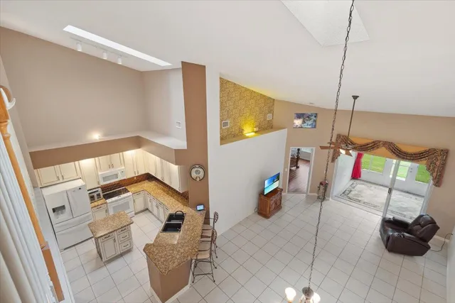 a view of a chair and table under an umbrella