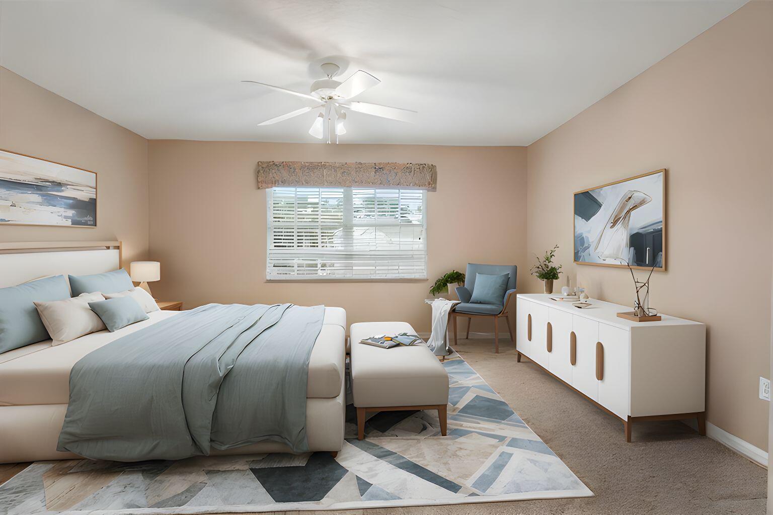 1634 Southwest Harbour Isles Circle, Unit 89 Port St. Lucie, FL 34986 - Photo 43 of 71 a large bedroom with a bed and a chandelier