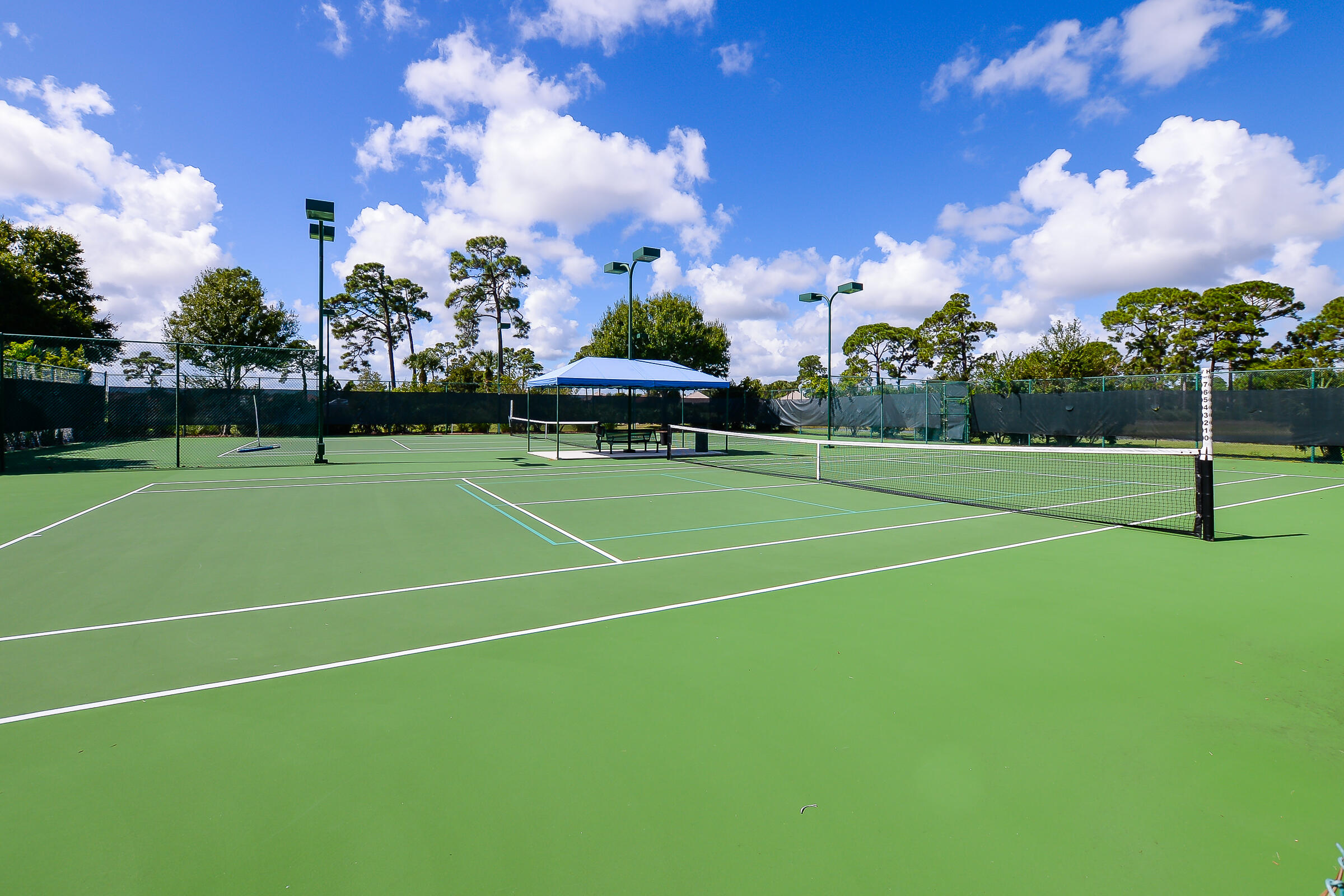 1634 Southwest Harbour Isles Circle, Unit 89 Port St. Lucie, FL 34986 - Photo 61 of 71 a view of an outdoor space and tennis court
