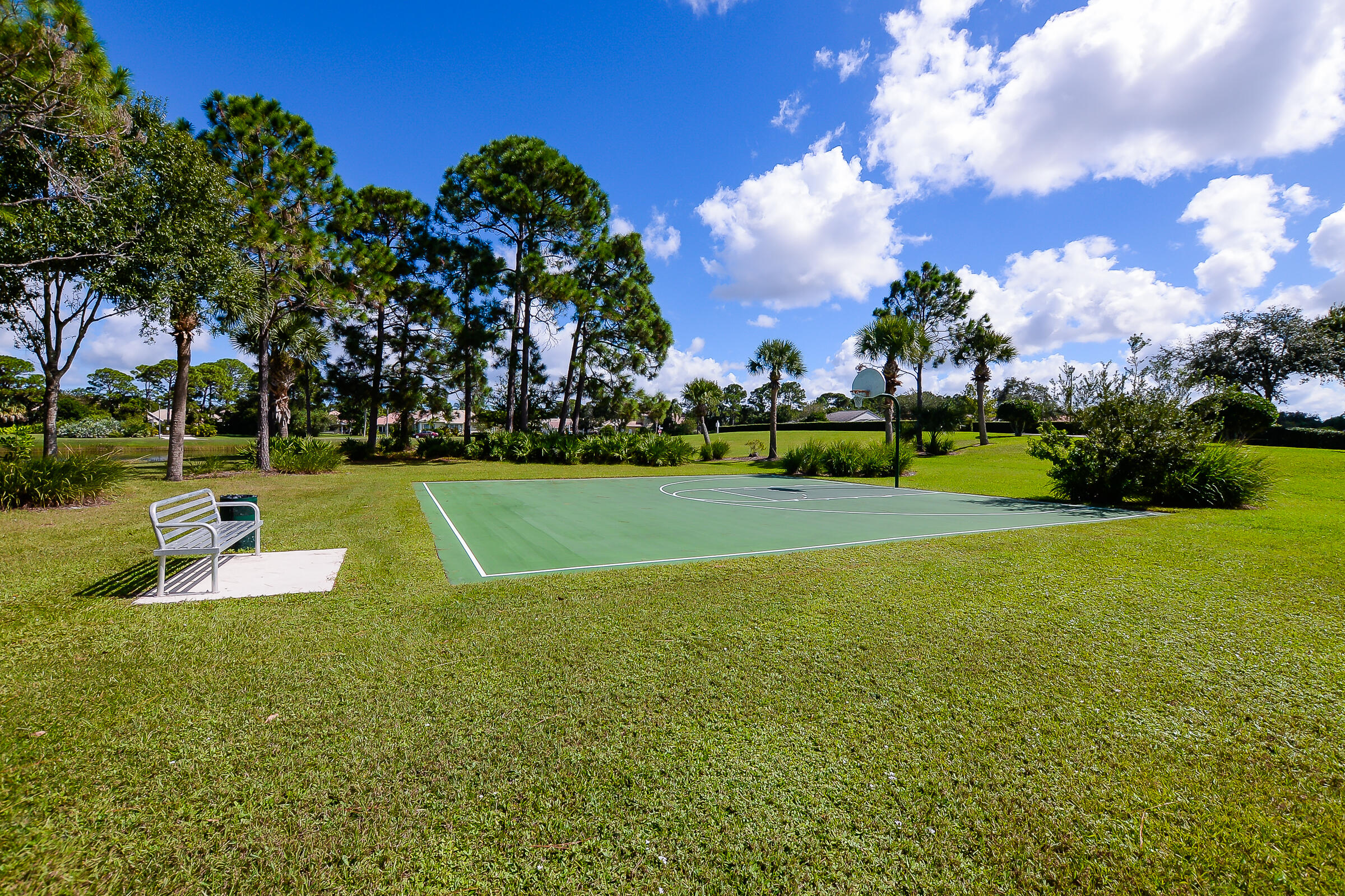 1634 Southwest Harbour Isles Circle, Unit 89 Port St. Lucie, FL 34986 - Photo 64 of 71 a view of a golf course with a lake