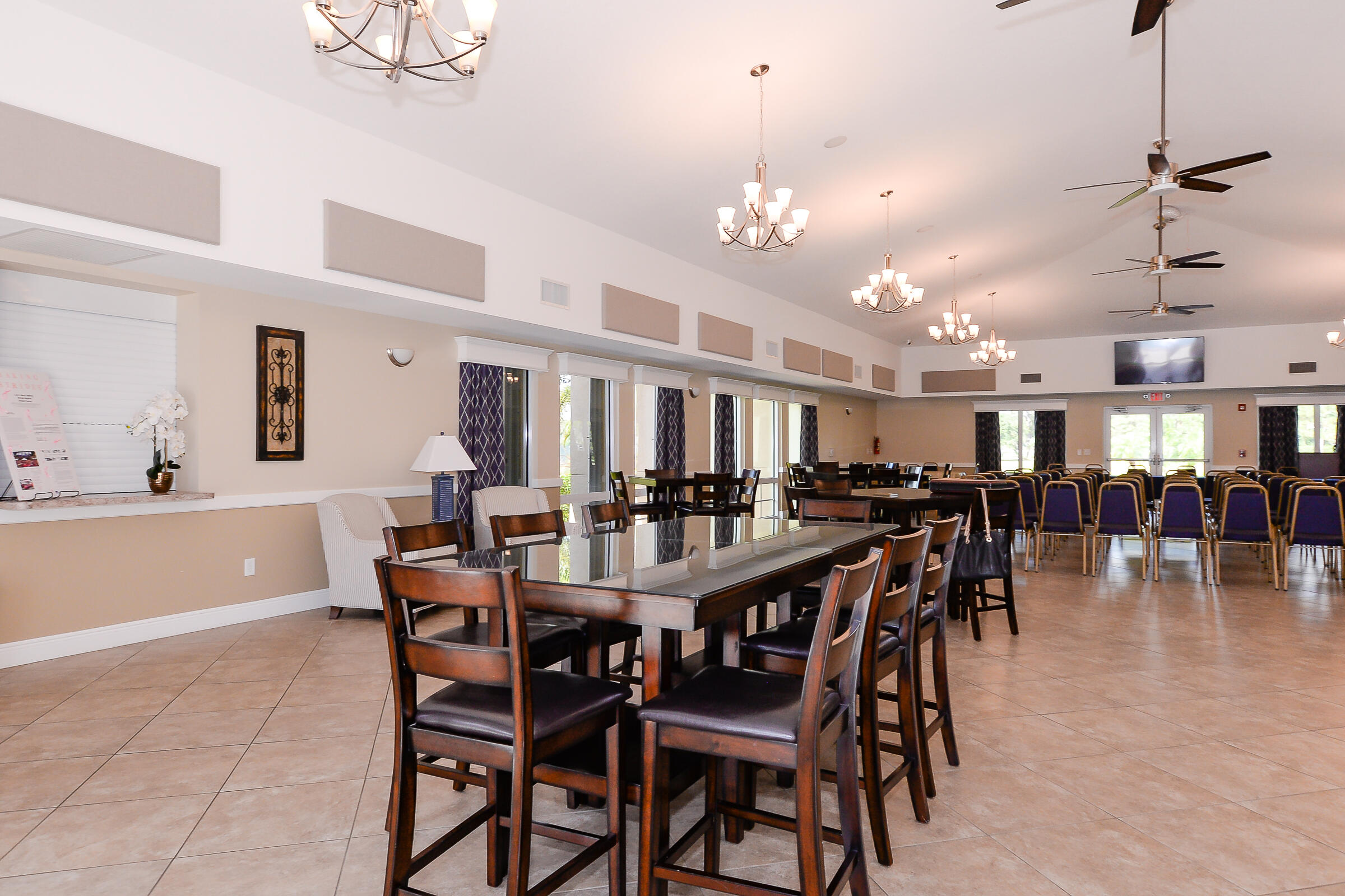 1634 Southwest Harbour Isles Circle, Unit 89 Port St. Lucie, FL 34986 - Photo 67 of 71 a view of a dining area with furniture and chandelier