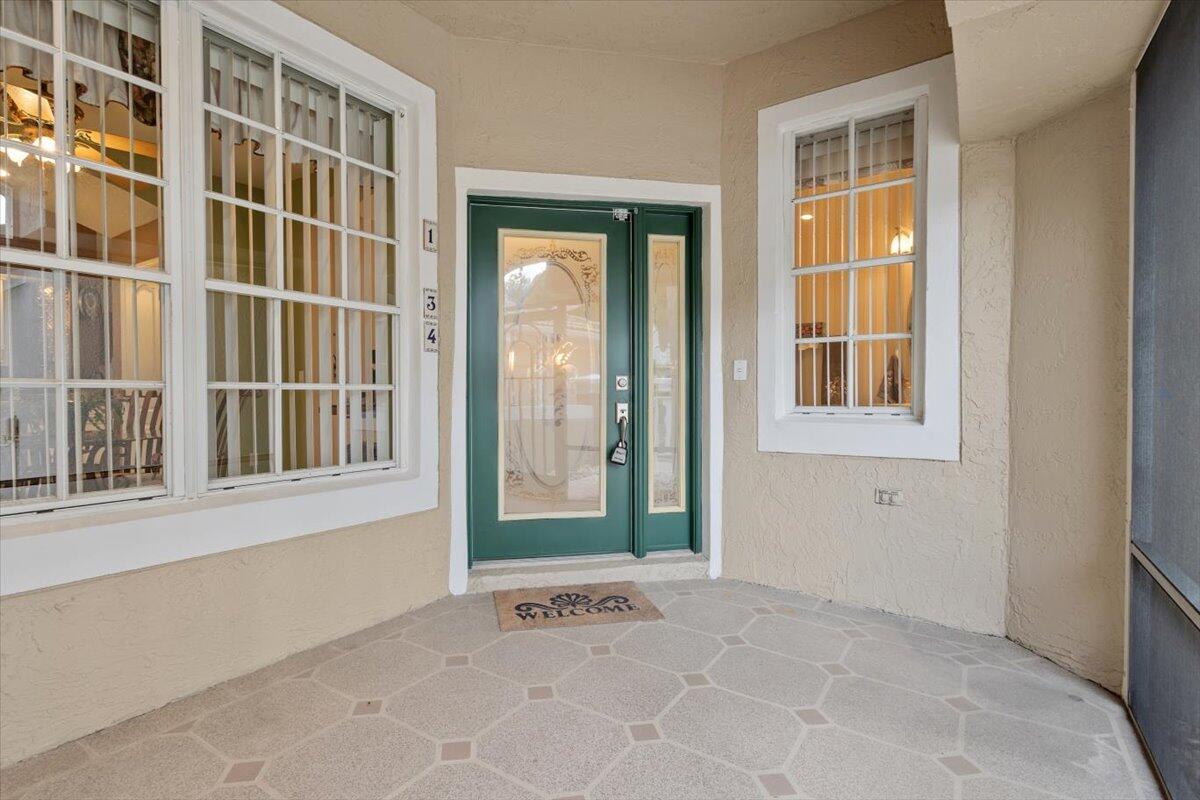 1634 Southwest Harbour Isles Circle, Unit 89 Port St. Lucie, FL 34986 - Photo 7 of 71 a view of an entryway with a window