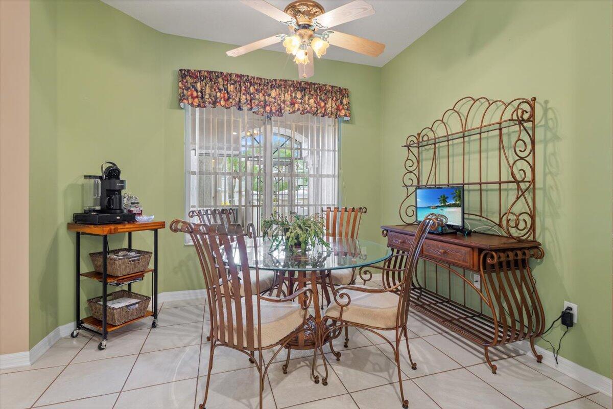1634 Southwest Harbour Isles Circle, Unit 89 Port St. Lucie, FL 34986 - Photo 10 of 71 a dining room with furniture and window