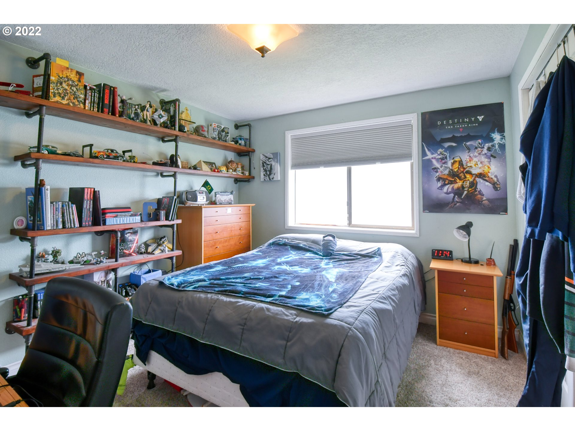817 Southwest 10th Street Pendleton, OR 97801 - Photo 18 of 25 a bed room with a bed and a television