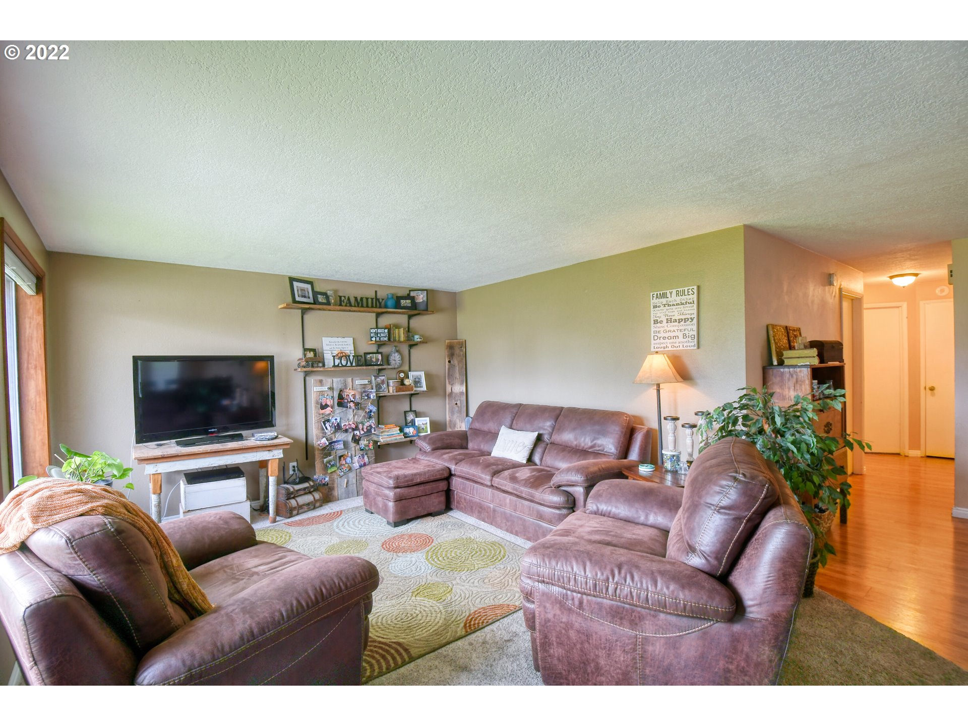817 Southwest 10th Street Pendleton, OR 97801 - Photo 4 of 25 a living room with furniture and a flat screen tv