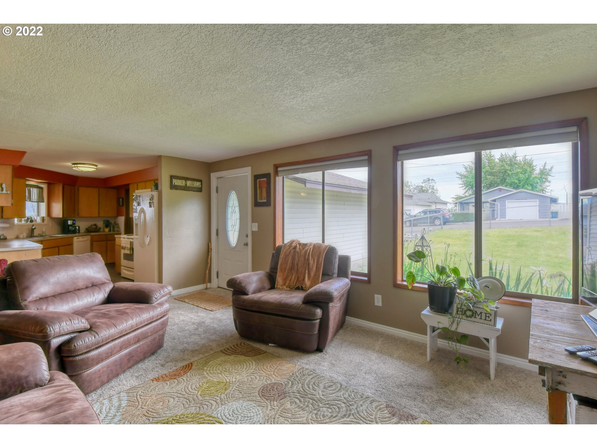 817 Southwest 10th Street Pendleton, OR 97801 - Photo 5 of 25 a living room with furniture and a large window
