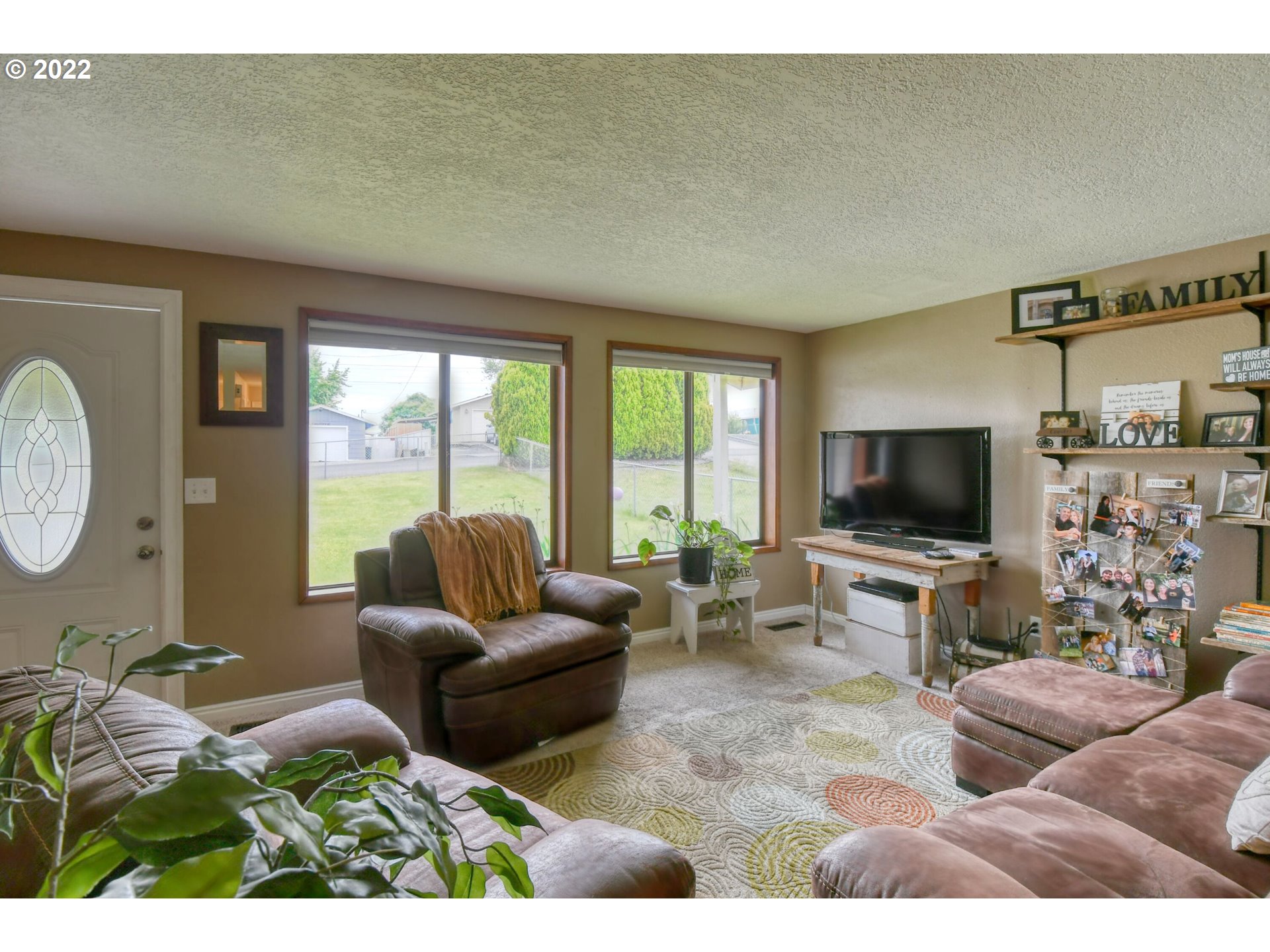 817 Southwest 10th Street Pendleton, OR 97801 - Photo 6 of 25 a living room with furniture and a flat screen tv