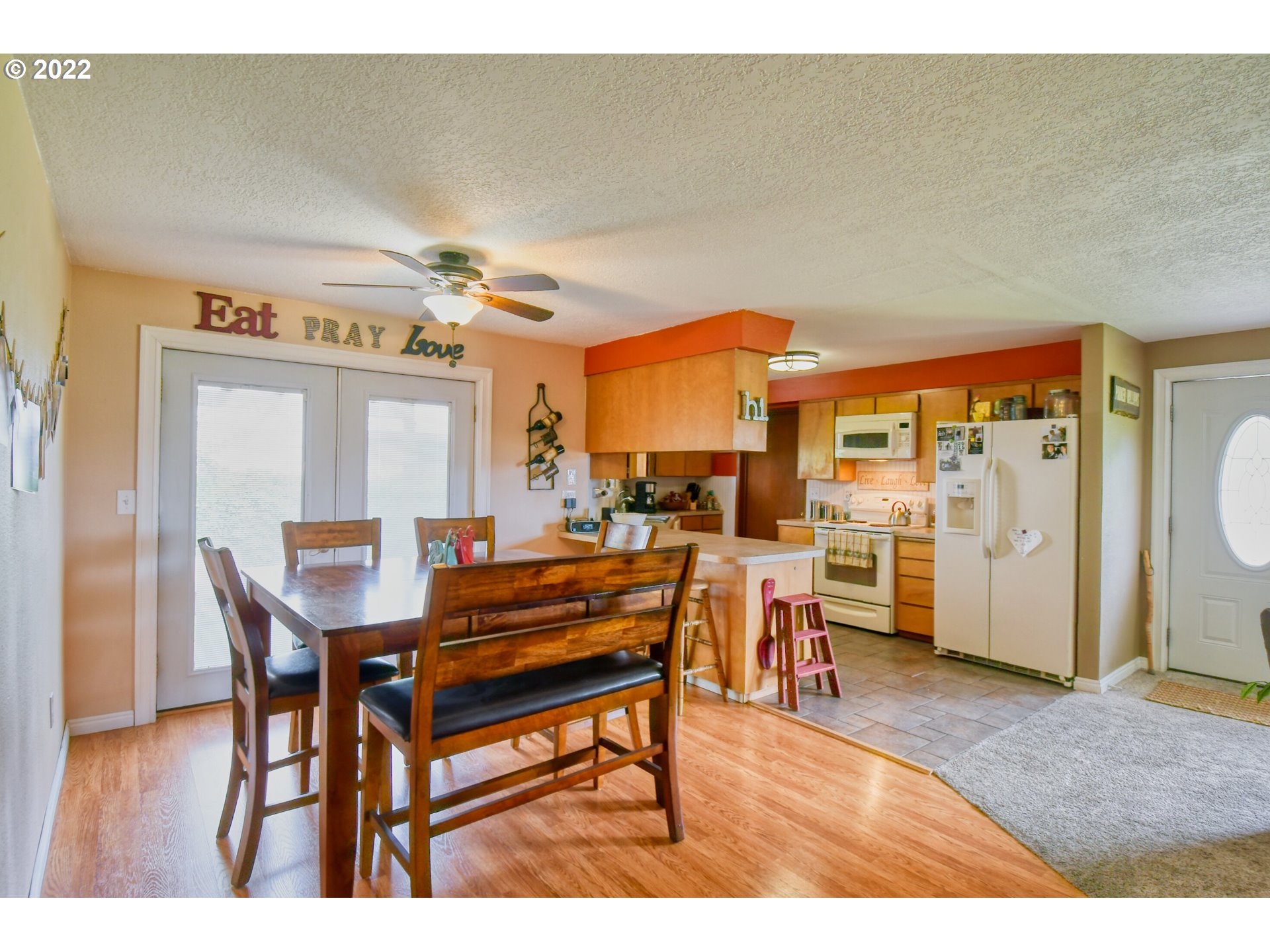 817 Southwest 10th Street Pendleton, OR 97801 - Photo 7 of 25 a dining room with furniture and wooden floor