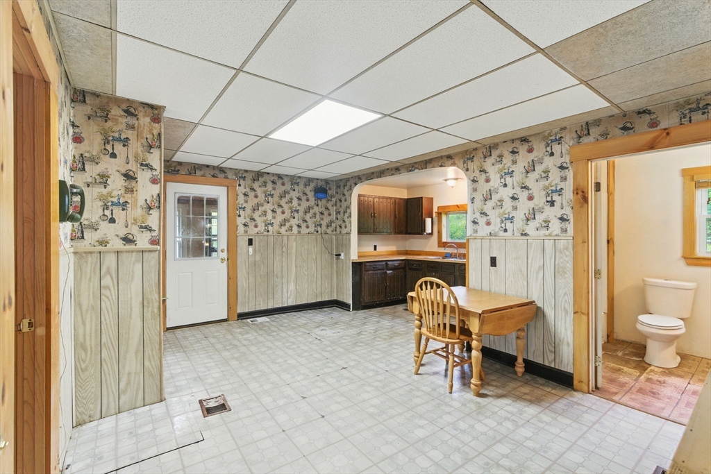 495 Winchendon Road Ashburnham, MA 01430 - Photo 12 of 40 a living room with furniture a flat screen tv and a fireplace