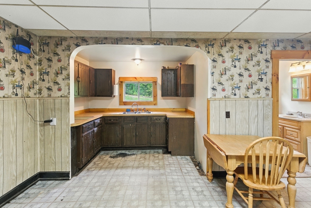 495 Winchendon Road Ashburnham, MA 01430 - Photo 13 of 40 a kitchen with a sink a counter top space and stainless steel appliances