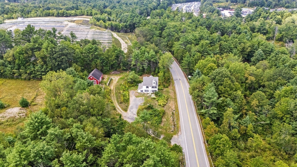 495 Winchendon Road Ashburnham, MA 01430 - Photo 2 of 40 a view of a yard with plants and large trees