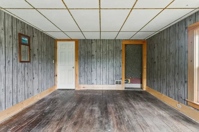 a view of a bedroom with a bed and furniture