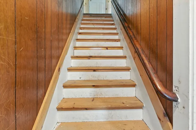 a view of entryway with wooden door