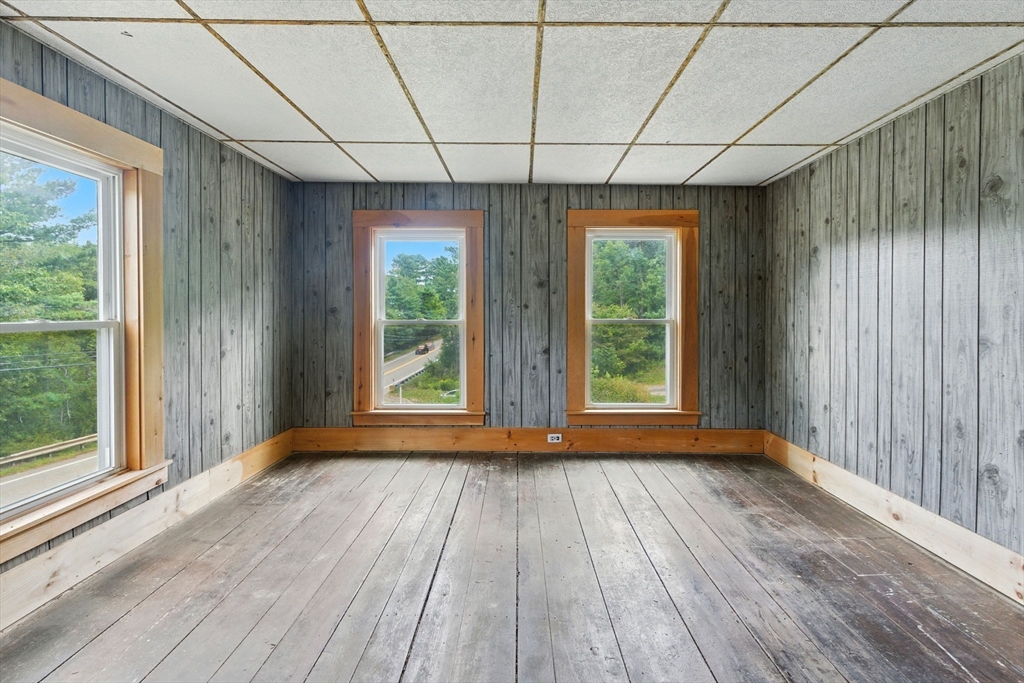 495 Winchendon Road Ashburnham, MA 01430 - Photo 34 of 40 a view of room with wooden floor and large window
