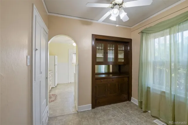 a view of entryway with chandelier fan and livingroom view