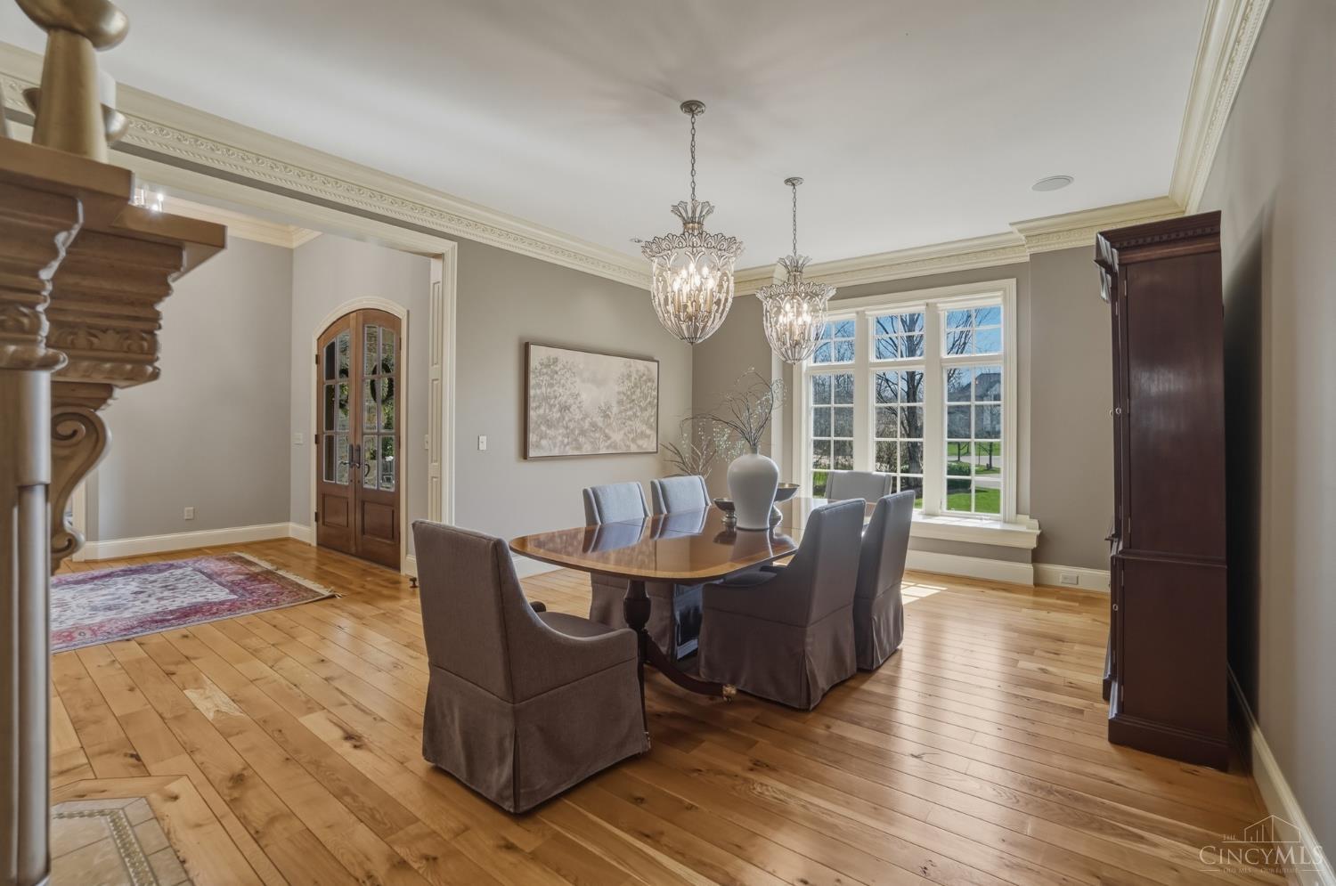 1054 Observatory Point Maineville, OH 45039 - Photo 27 of 82 Formal dining room with 2 chandeliers and another gas fireplace.