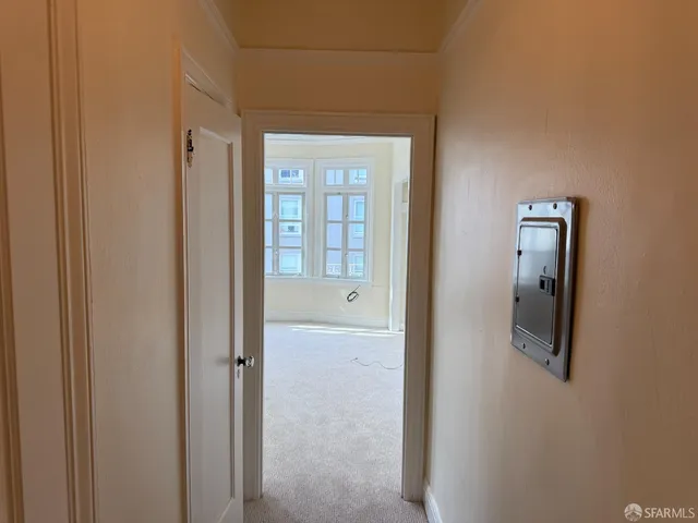a view of a bathroom from a hallway