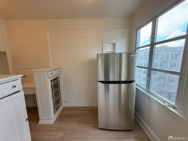 a white refrigerator freezer and a dishwasher in a kitchen