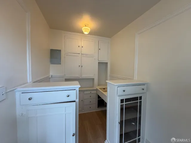 a view of cabinets with wooden floor