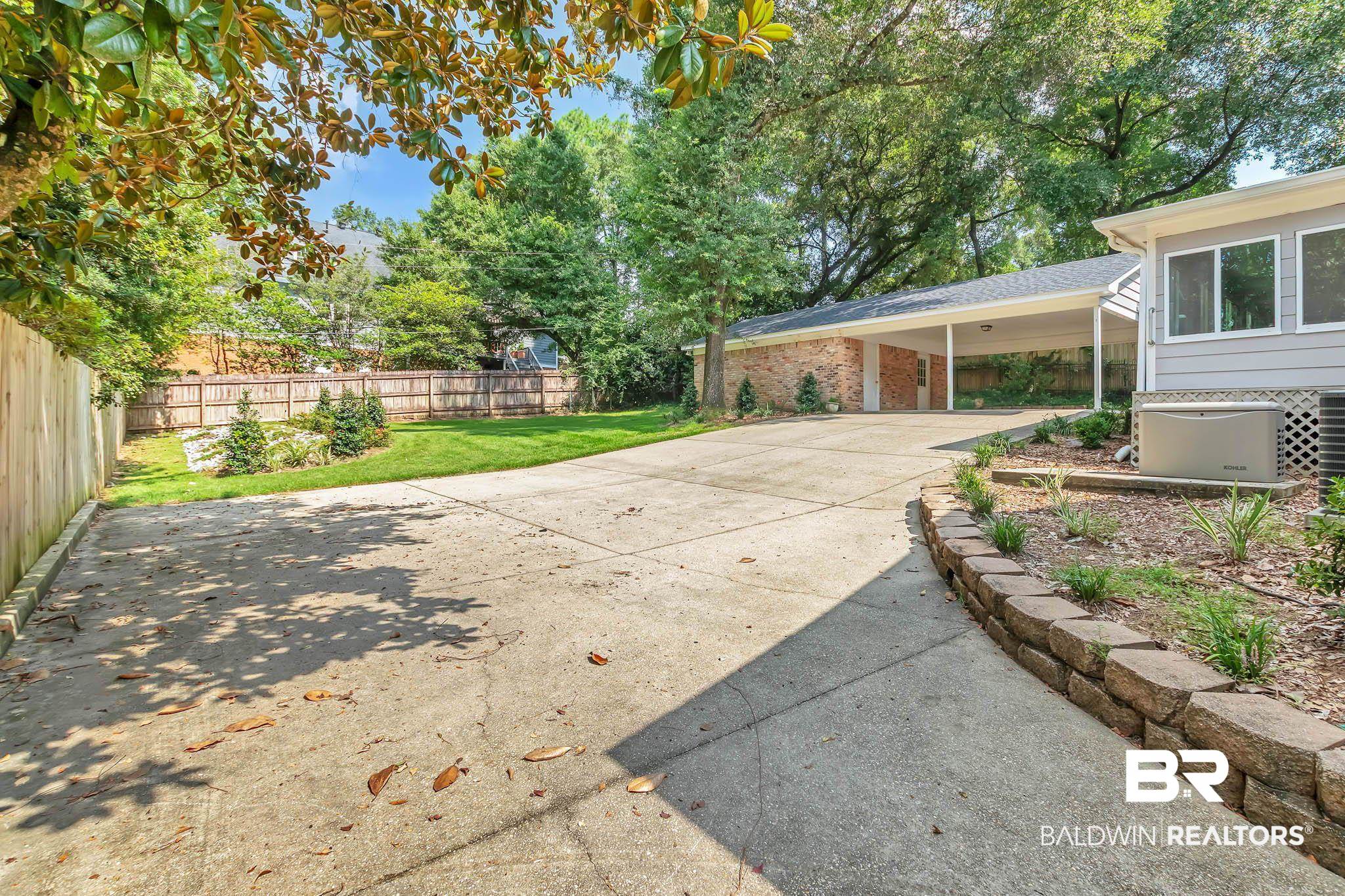 309 West Brandy Run Road Mobile, AL 36608 - Photo 89 of 100 View of patio / terrace with an attached carport and driveway