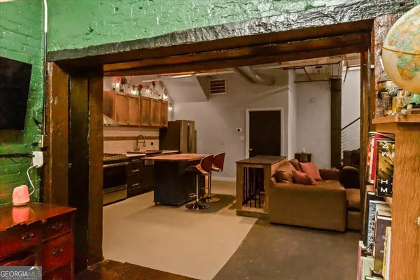 view of living room with furniture and floor to ceiling window