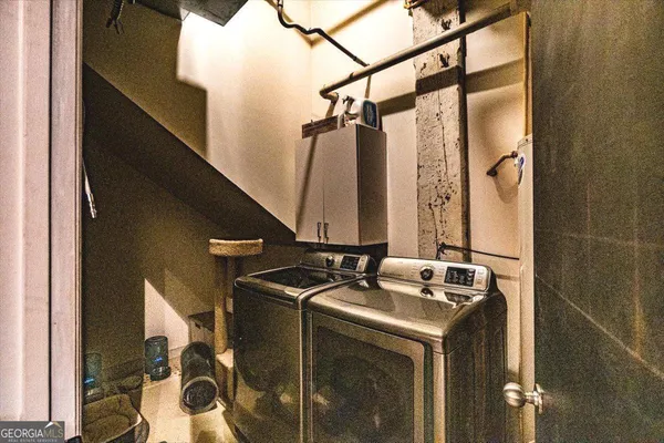 a spacious bedroom with a bed and a table