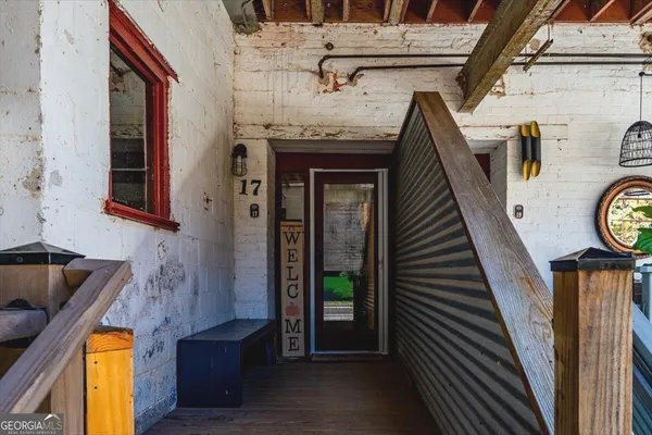 a view of entryway with wooden floor