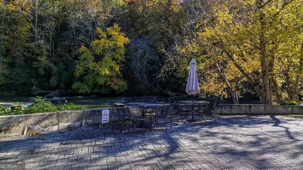 a view of a yard with a tree