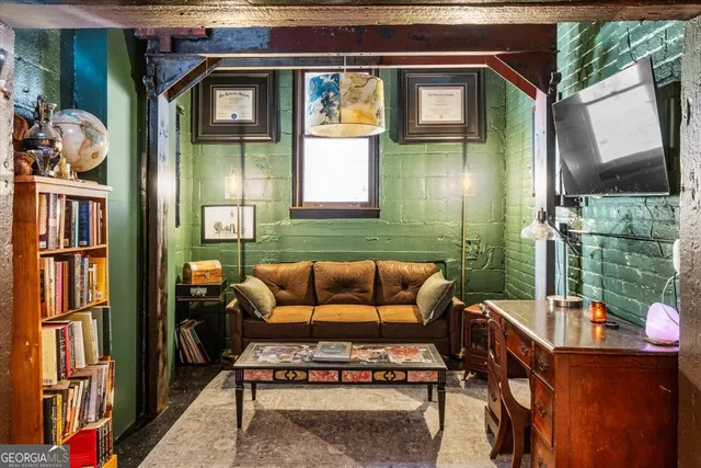 a view of a patio with couches chairs and potted plants