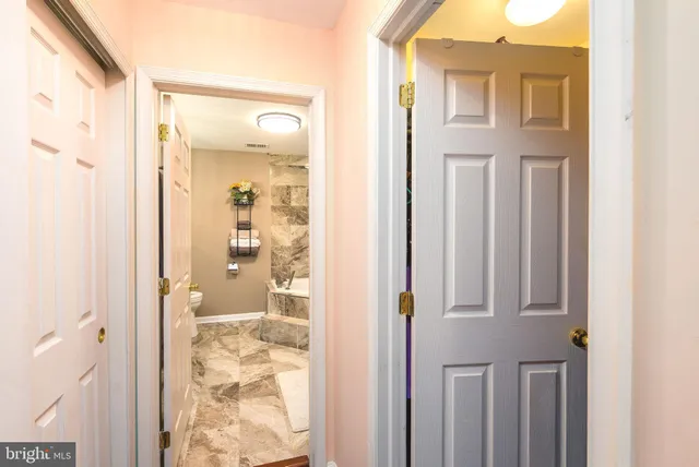 a view of a bathroom with a shower and a bathroom