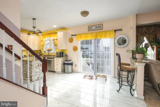 a view of living room with furniture and a large window