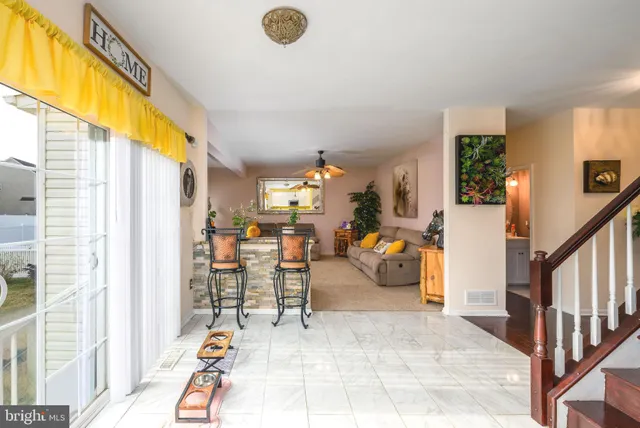 a view of a livingroom with furniture and a window