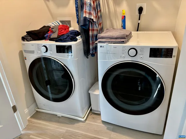 a view of a house with a deck and furniture