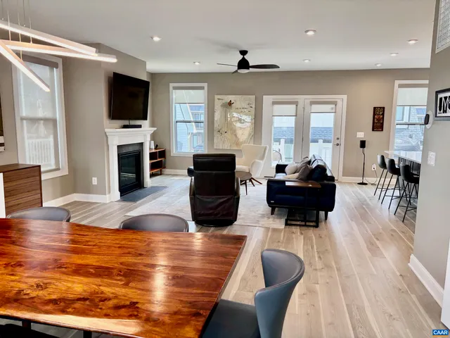 a living room with fireplace furniture and a flat screen tv